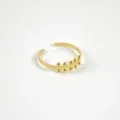 BAGUE ANNEAU FIN PERLES SYMETRIQUES ACIER INOXYDABLE GOLD PETIT PRIX